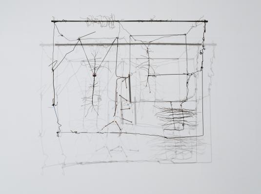 A hanging 3D sculpture consisting of wire, string, wood, and aluminum tubes.