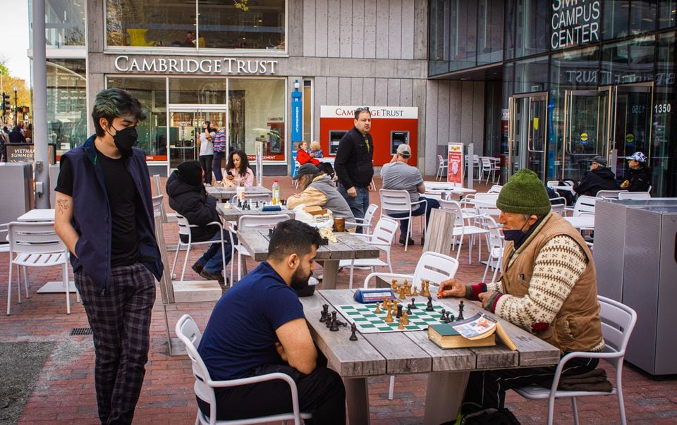 A typical afternoon of speed chess and trash talk outside Harvard Square's Pavement Coffeehouse.