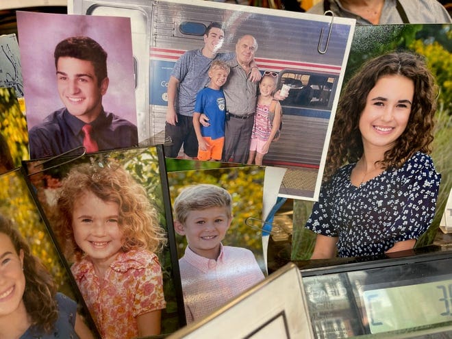 Photos of Cambridge cobbler Christos Soillis' family that hang in his Harvard Square shop.