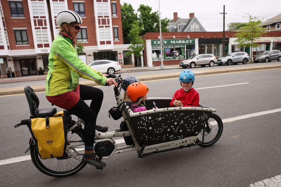 Katherine B. and her family used a bike lane in Cambridge. Because she uses the bike lane with her young children daily, she is hoping the protected bike lanes will come together as soon as possible.