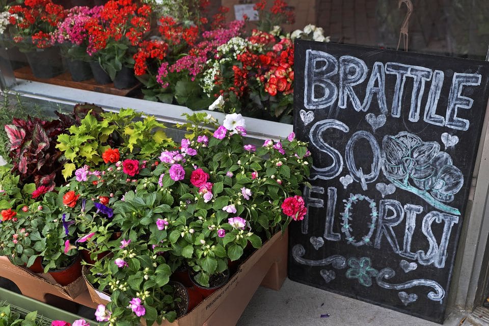 A sign outside the Brattle Square Florist's new location.