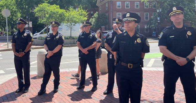 Cambridge police officers pay respects to Michael in Harvard Square on June 30, 2022.