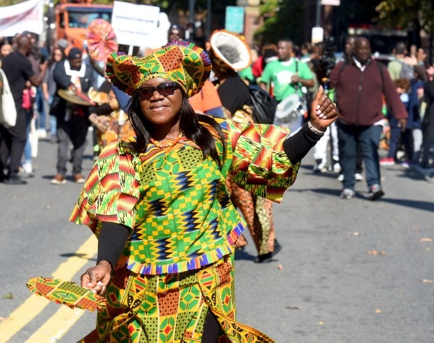 CAMBRIDGE, MA October 9: An ethnic group dances into Harvard Square during the 17th Annual Honk! Parade on Massachusetts Ave, part of the 43rd annual Octoberfest in Harvard Square, Sunday,October 9, 2022, in Cambridge, Mass. (Photo By Jim Michaud/ Boston Herald)