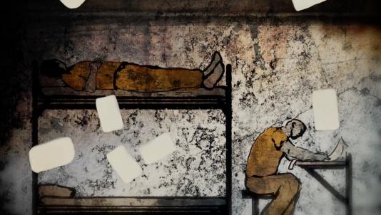 Two incarcerated men in orange clothes are in a cell together, one lying down and one drawing at a table.