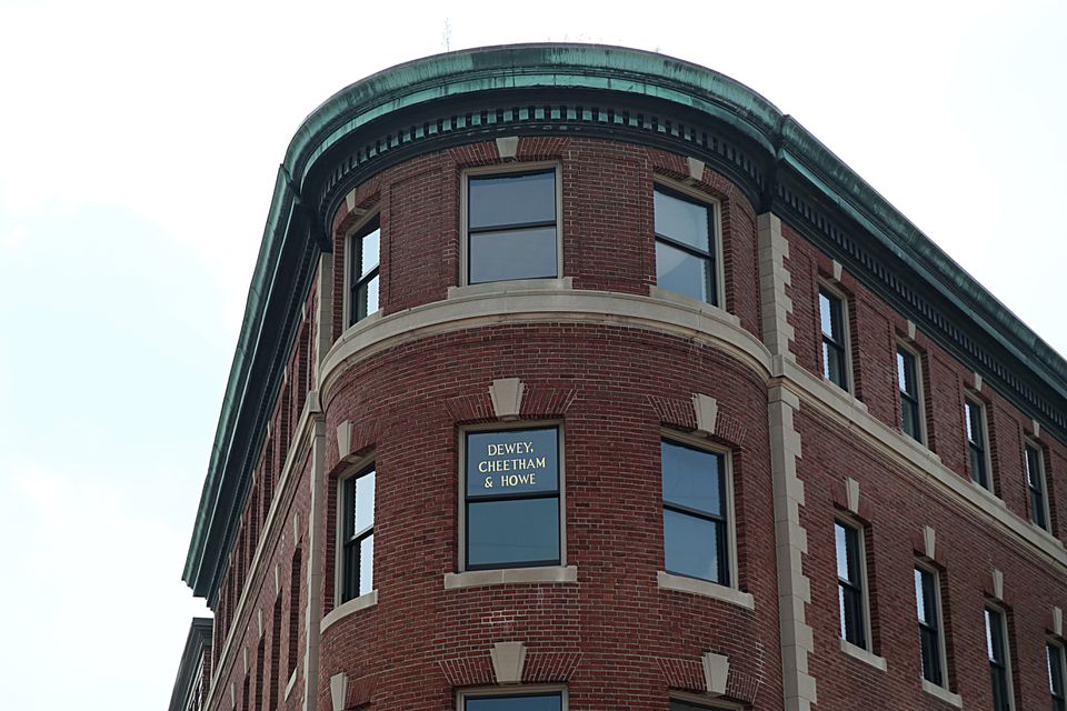 Car Talk's "Dewey Cheetham & Howe" window sign on the Abbott building in Harvard Square now hangs over a yoga studio inside the Central Rock Gym, a climbing facility that opened last summer.