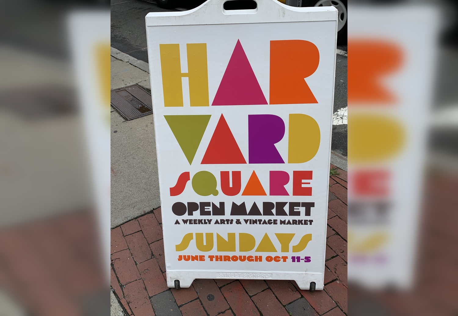The Harvard Square Open Market sign greets visitors as they enter the market.