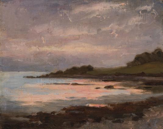 A cove reflecting the pink sky is bordered by a rocky shore in this view of a sunset.