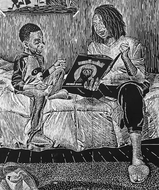 A black and white print shows a mother sitting on a bed and reading to her son before bedtime.