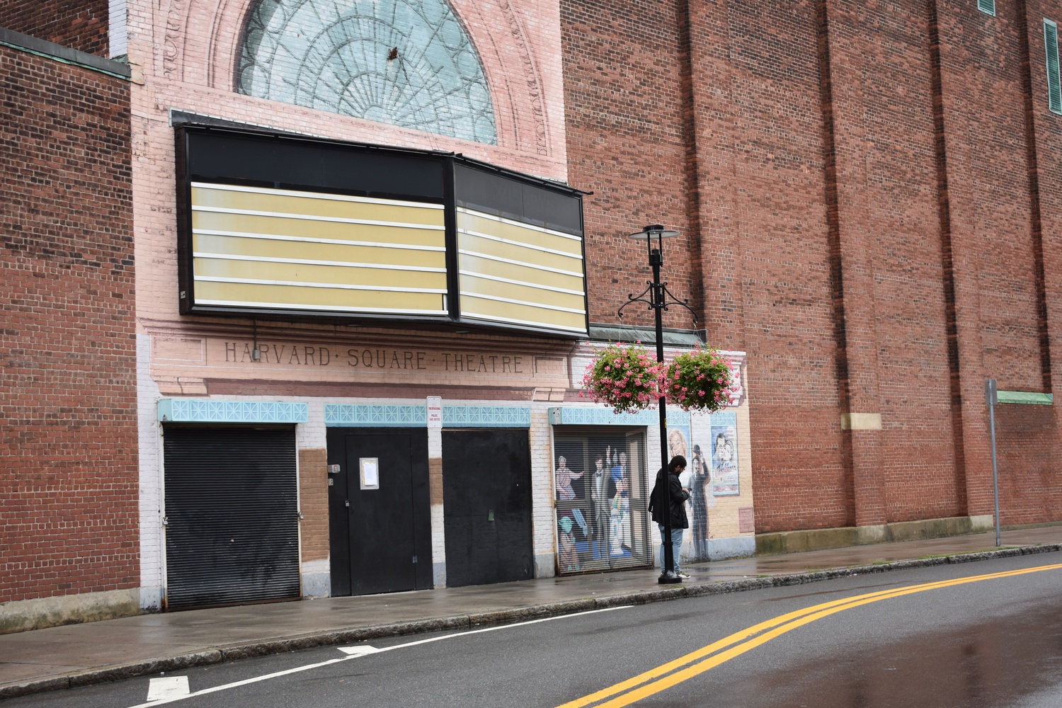 The Harvard Square Theater, located at 10 Church St. and owned by billionaire investor Gerald L. Chan, has been vacant for 13 years. On Monday, the Cambridge City Council voted to ask owners of long-vacant buildings to describe their plans for development.