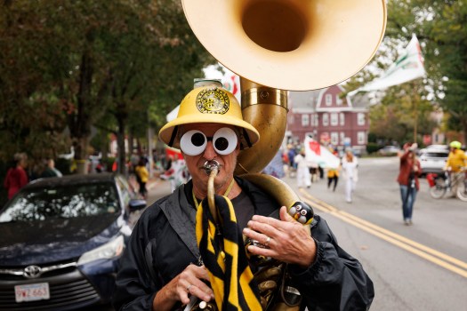 SOMERVILLE, MASSACHUSETTS: 'Dr. Yes,' plays his sousaphone as he marches with the Expandable Brass Band in the 20th annual Honk! Festival parade, on Oct. 12 2025. Over 30 bands from all over the United States, including Seattle, Chicago, New Orleans, San Francisco, Atlanta, Minneapolis, and Pittsburgh, took part in the annual parade with this year's theme, 'Reclaim the Streets for Horns, Bikes, and Feet'. (CJ Gunther/Boston Herald)